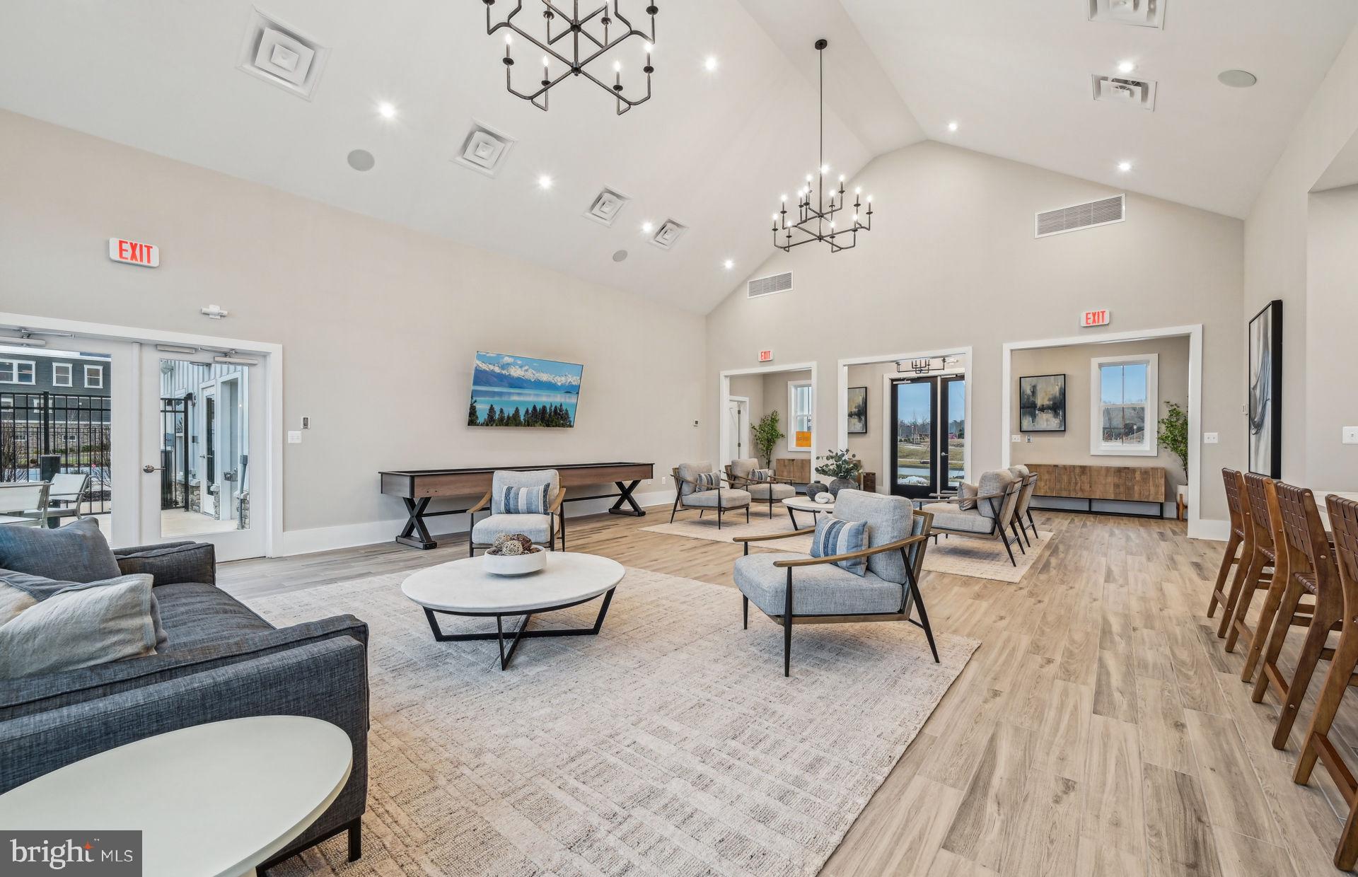 22412 Sculpin Brk Road Boyds, MD 20841 - Photo 31 of 37 a living room with furniture kitchen view and a chandelier