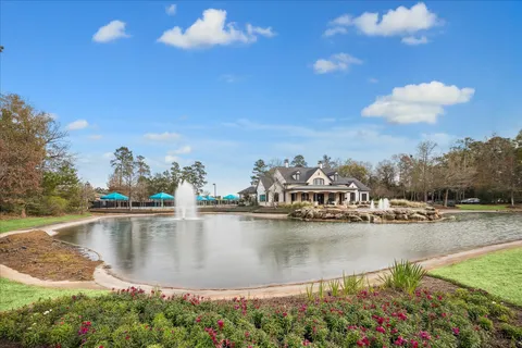 an aerial view of a house with a swimming pool and outdoor seating