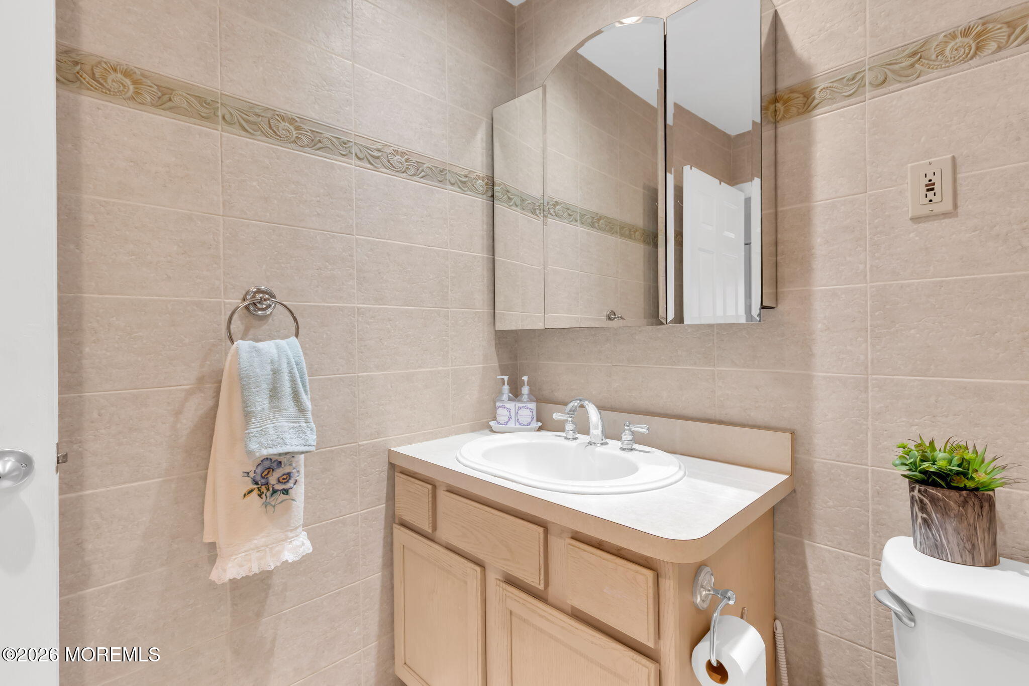 101 Andover Lane Matawan, NJ 07747 - Photo 32 of 51 a bathroom with a sink and mirror
