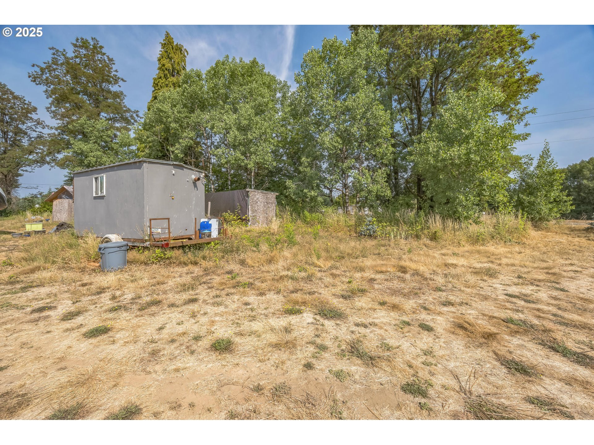 213 Nelson Road Winlock, WA 98596 - Photo 22 of 30 a backyard of a house with lots of green space