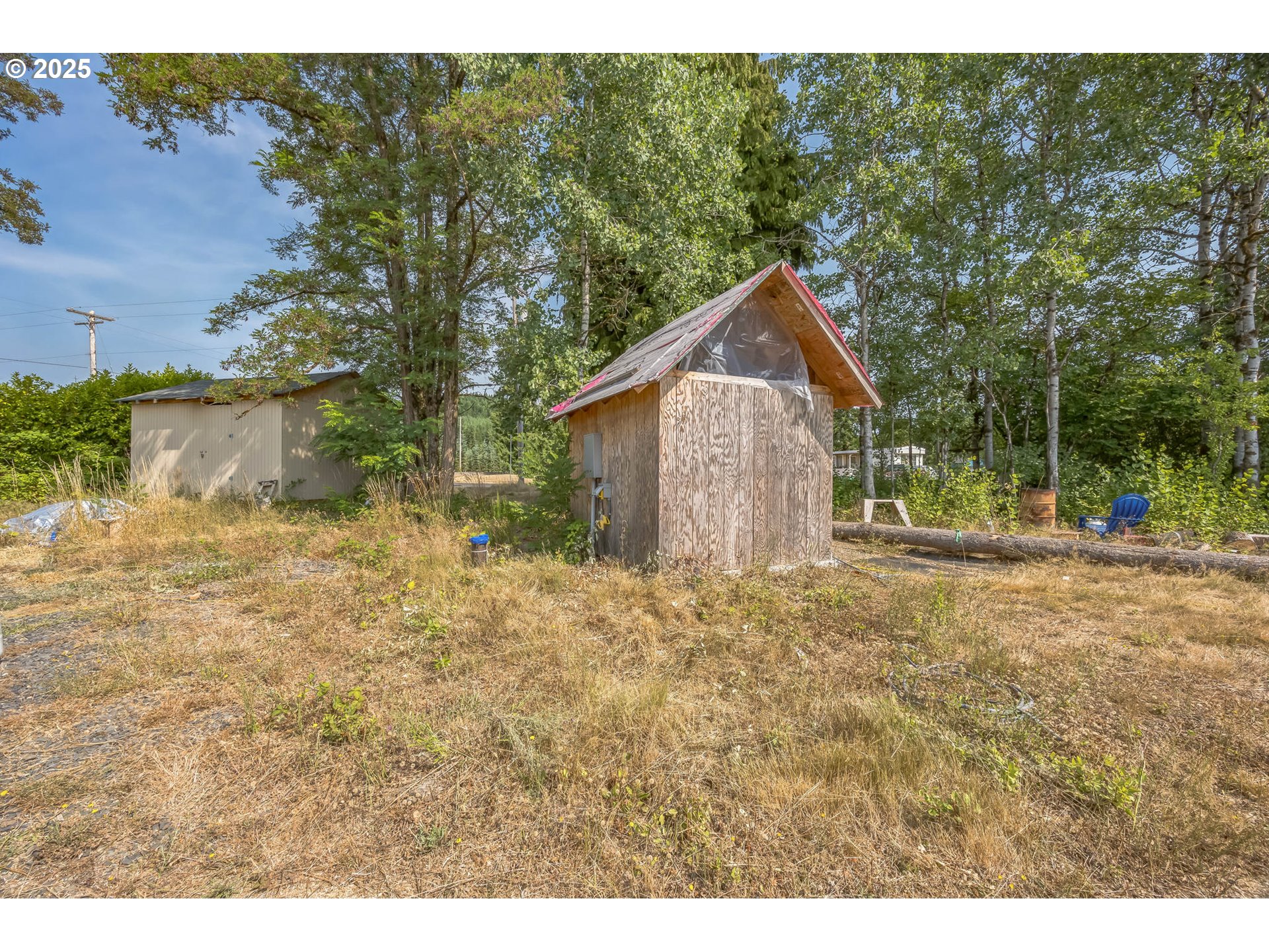 213 Nelson Road Winlock, WA 98596 - Photo 25 of 30 a backyard of a house with lots of green space
