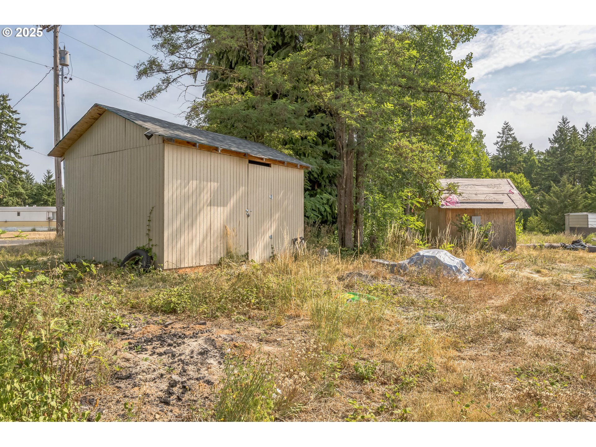 213 Nelson Road Winlock, WA 98596 - Photo 26 of 30 a backyard of a house with a yard and seating area