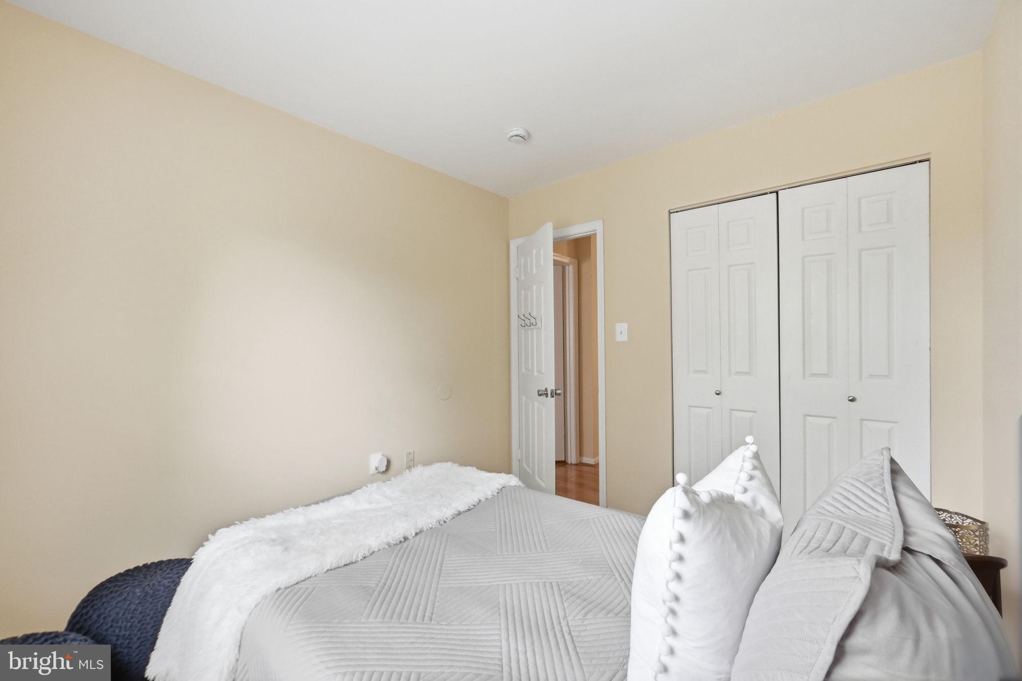 6470 Franconia Court Springfield, VA 22150 - Photo 18 of 31 a bedroom with a bed and a couch