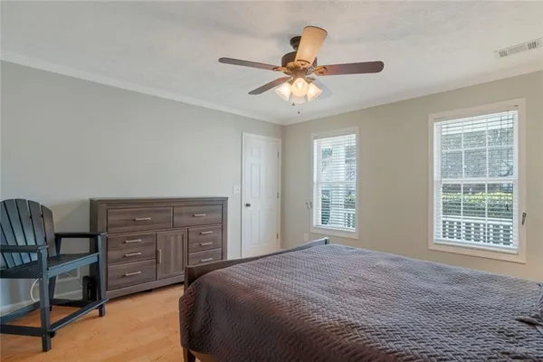 a bedroom with a bed and a television