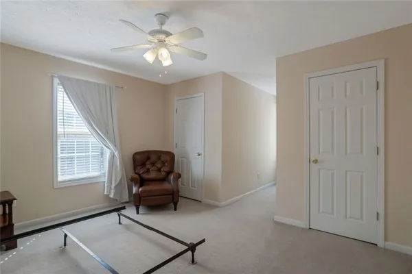 a living room with furniture and windows