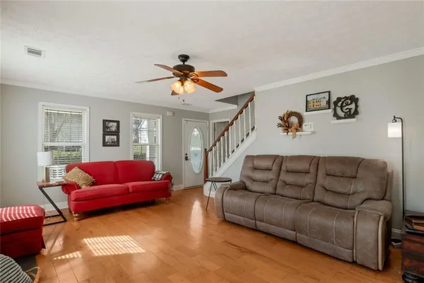a living room with furniture and a window