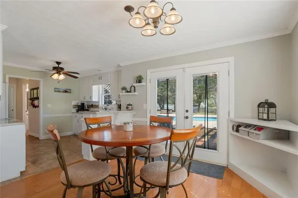 a view of a dining room with furniture window and outside view