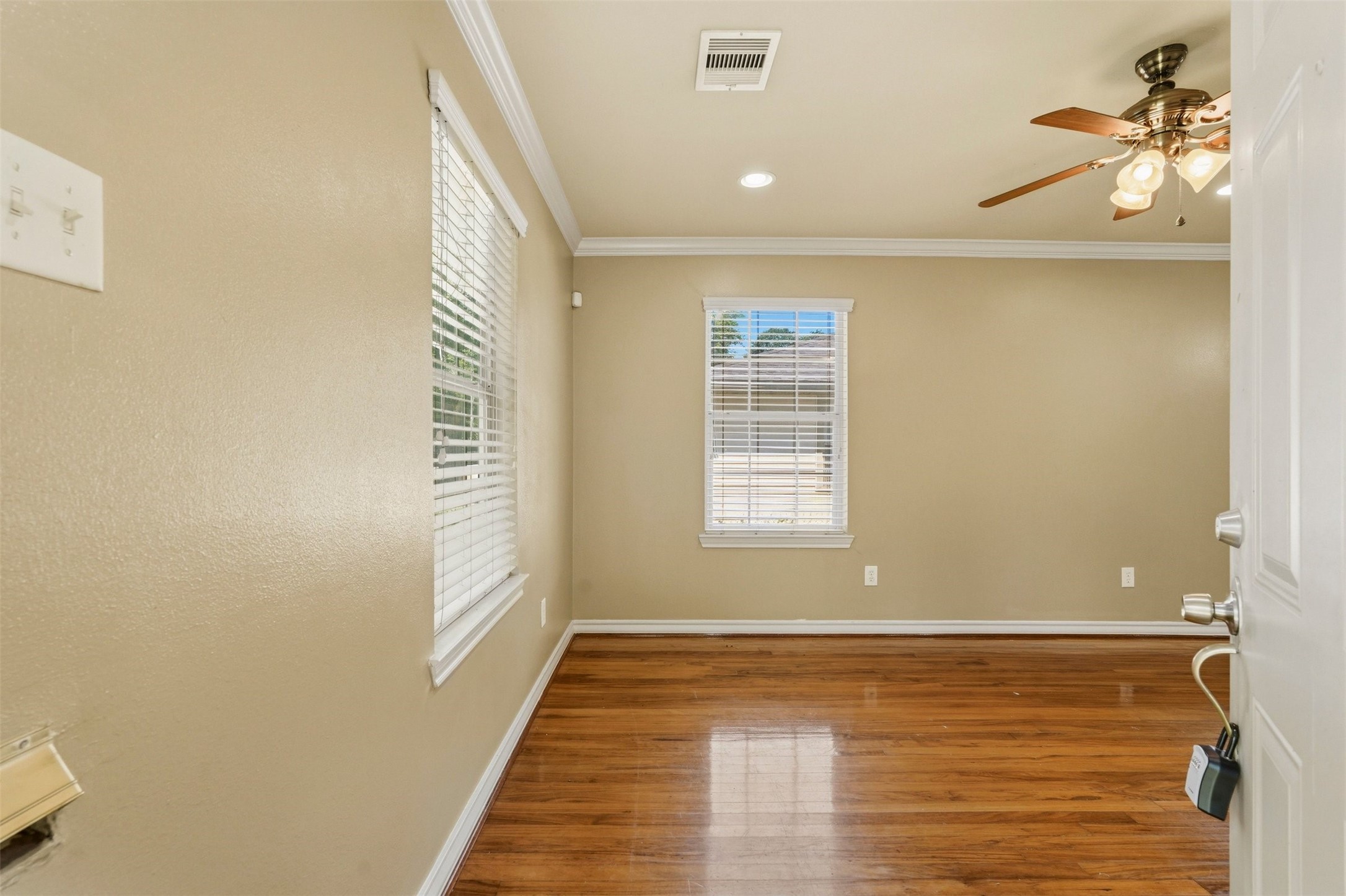 3445 Nathaniel Brown Street Houston, TX 77021 - Photo 2 of 19 a view of empty room with wooden floor and fan