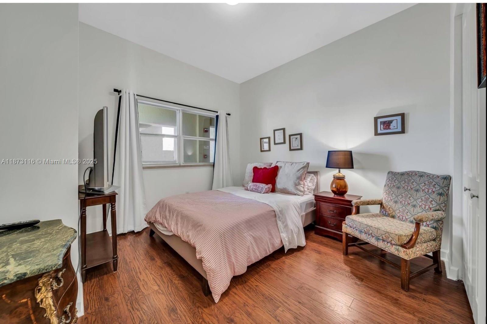 1607 Ponce De Leon, Unit 10C Coral Gables, FL 33134 - Photo 12 of 19 a bedroom with a bed and a couch