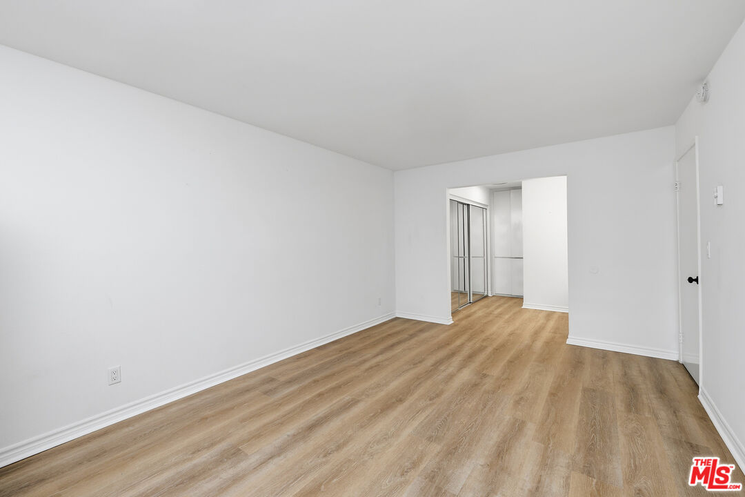 7740 Redlands Street, Unit G1095 Playa del Rey, CA 90293 - Photo 11 of 25 a view of empty room with wooden floor
