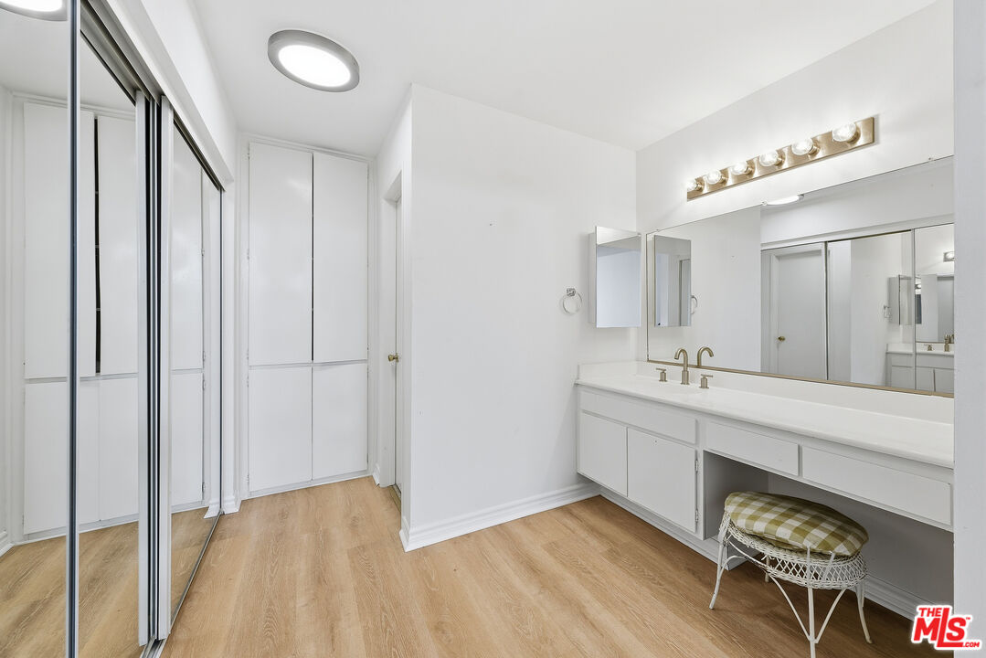 7740 Redlands Street, Unit G1095 Playa del Rey, CA 90293 - Photo 14 of 25 a spacious bathroom with a double vanity sink and a mirror