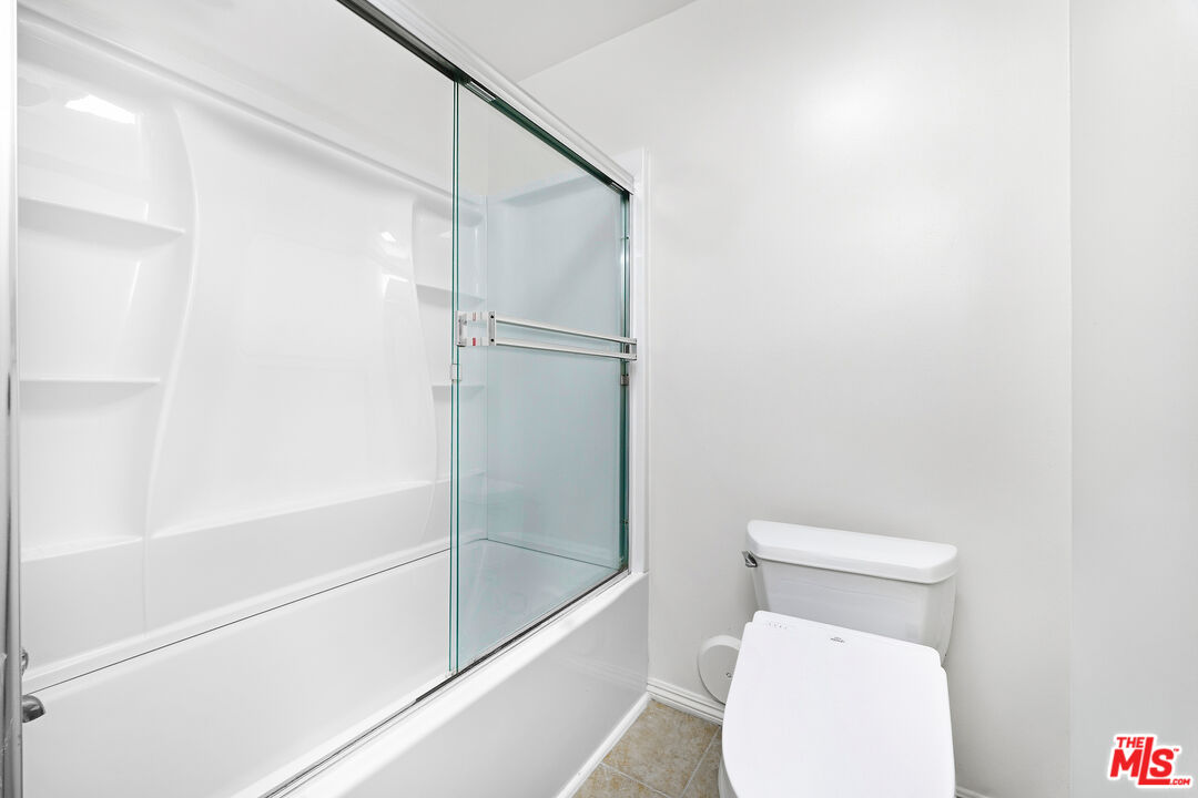 7740 Redlands Street, Unit G1095 Playa del Rey, CA 90293 - Photo 15 of 25 a white toilet sitting next to a bath tub