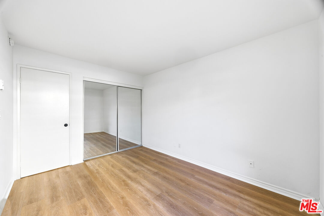 7740 Redlands Street, Unit G1095 Playa del Rey, CA 90293 - Photo 16 of 25 a view of empty room with wooden floor