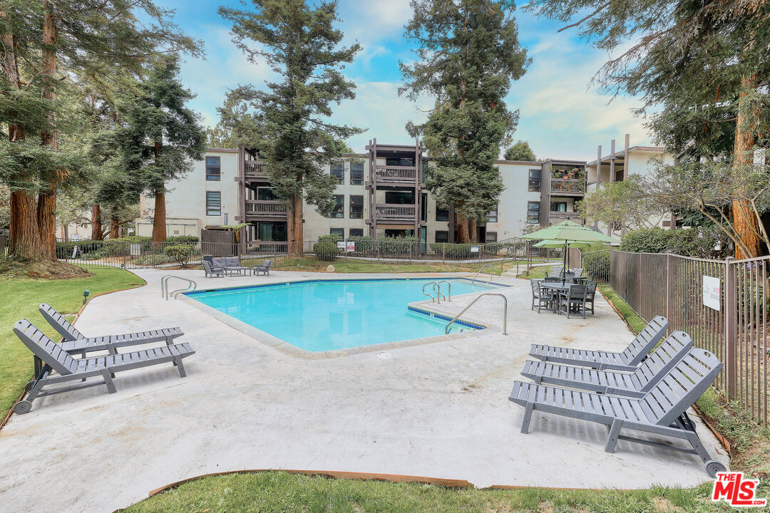 7740 Redlands Street, Unit G1095 Playa del Rey, CA 90293 - Photo 18 of 25 a view of a house with swimming pool and sitting area