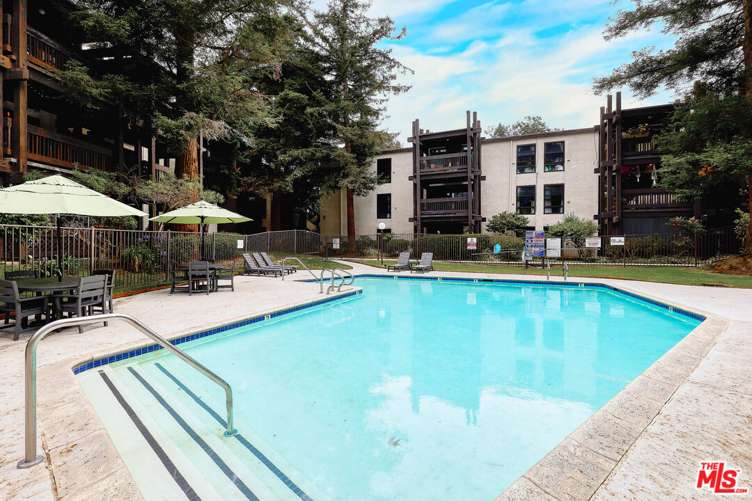 7740 Redlands Street, Unit G1095 Playa del Rey, CA 90293 - Photo 3 of 25 a view of a swimming pool with a patio