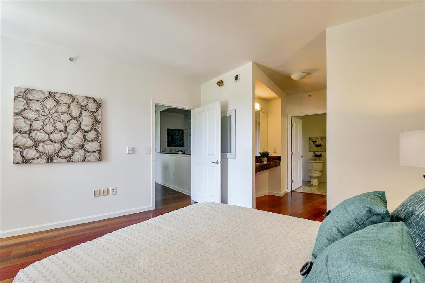 140 South Van Ness Avenue, Unit 422 San Francisco, CA 94103 - Photo 17 of 32 a bedroom with a bed and a couch