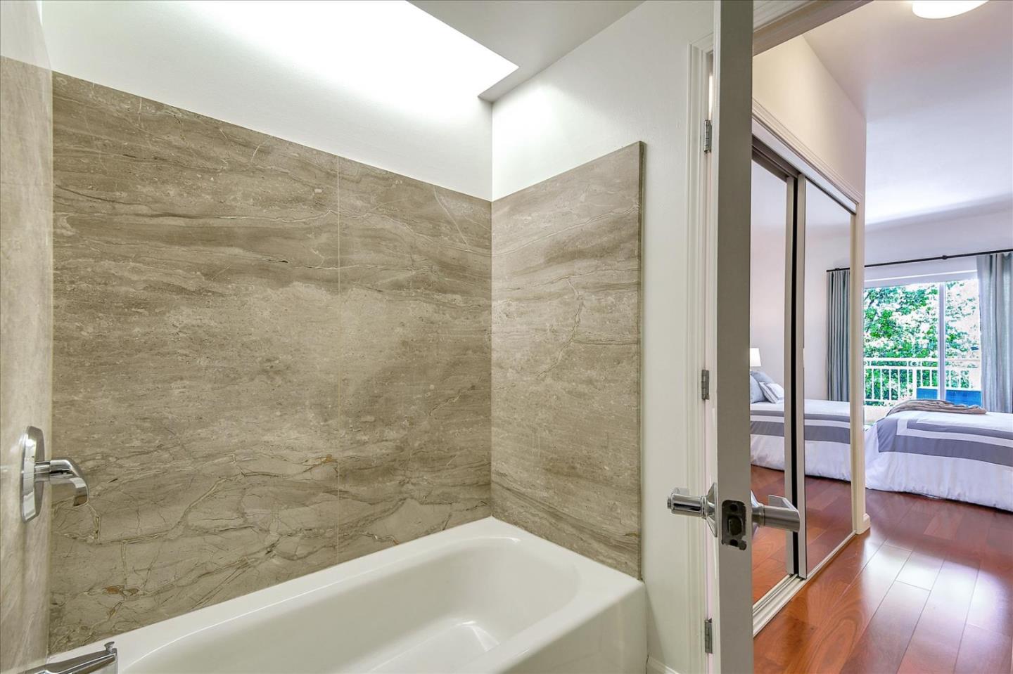 140 South Van Ness Avenue, Unit 422 San Francisco, CA 94103 - Photo 19 of 32 a bathroom with a bathtub and a shower