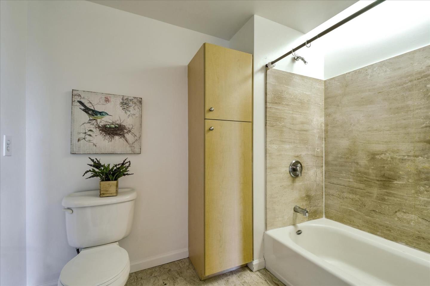140 South Van Ness Avenue, Unit 422 San Francisco, CA 94103 - Photo 21 of 32 a bathroom with a toilet a sink and bathtub