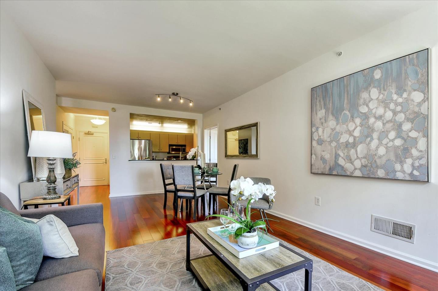 140 South Van Ness Avenue, Unit 422 San Francisco, CA 94103 - Photo 3 of 32 a living room with furniture and a table