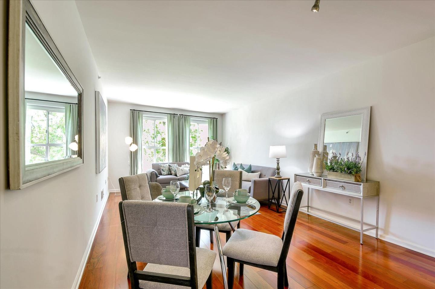 140 South Van Ness Avenue, Unit 422 San Francisco, CA 94103 - Photo 8 of 32 a dining room with furniture and wooden floor
