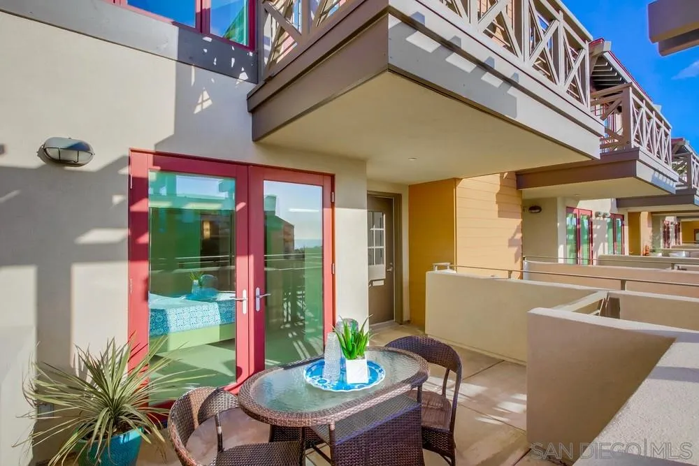 90 North Coast Highway 101, Unit 312 Encinitas, CA 92024 - Photo 19 of 19 a view of a patio with a table and chairs