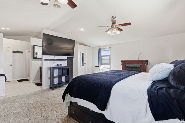 830 North Stone Road Snowville, UT 84336 - Photo 25 of 69 Bedroom with ceiling fan, vaulted ceiling, light colored carpet, recessed lighting, and ensuite bath