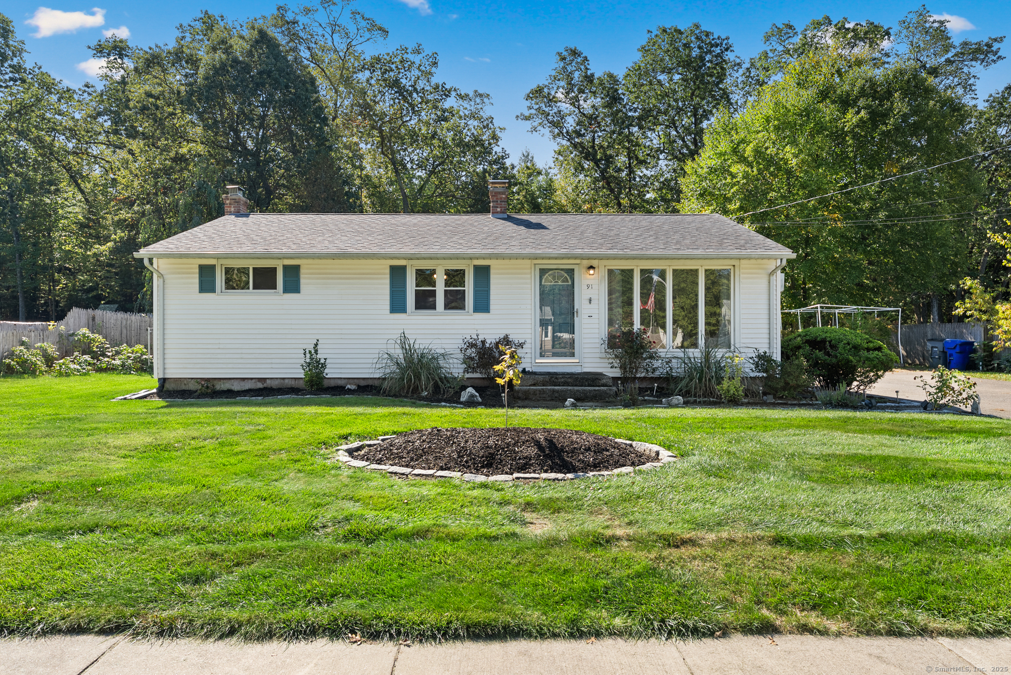 91 Till Street Enfield, CT 06082 - Photo 1 of 30 a front view of a house with a yard table and chairs