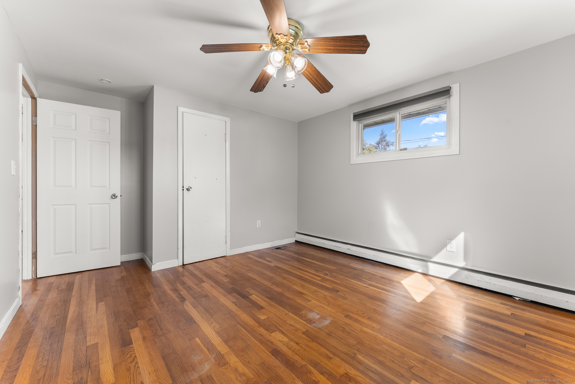 91 Till Street Enfield, CT 06082 - Photo 11 of 30 a view of empty room with wooden floor