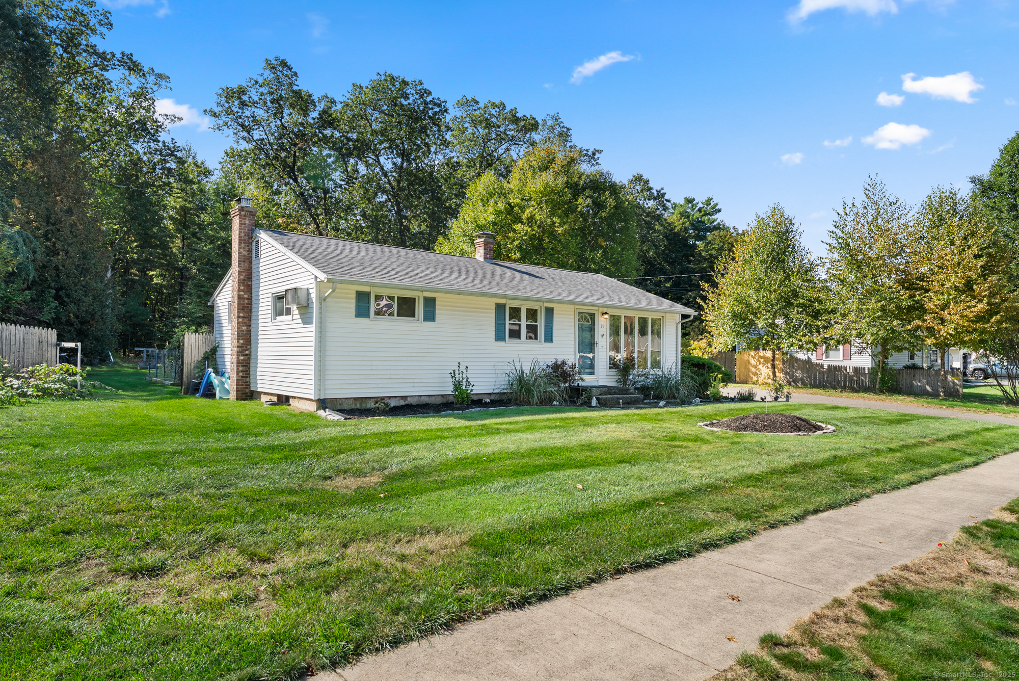 91 Till Street Enfield, CT 06082 - Photo 20 of 30 a front view of house with yard and green space