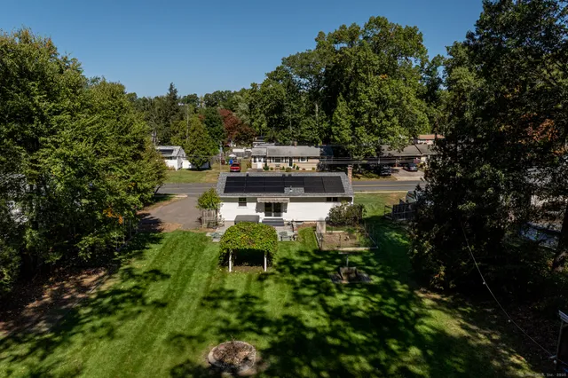 a wooden bench sitting in the middle of a forest