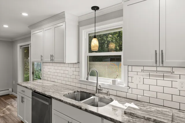 a kitchen with a sink and a window