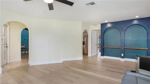 a bedroom with a bed and lamp