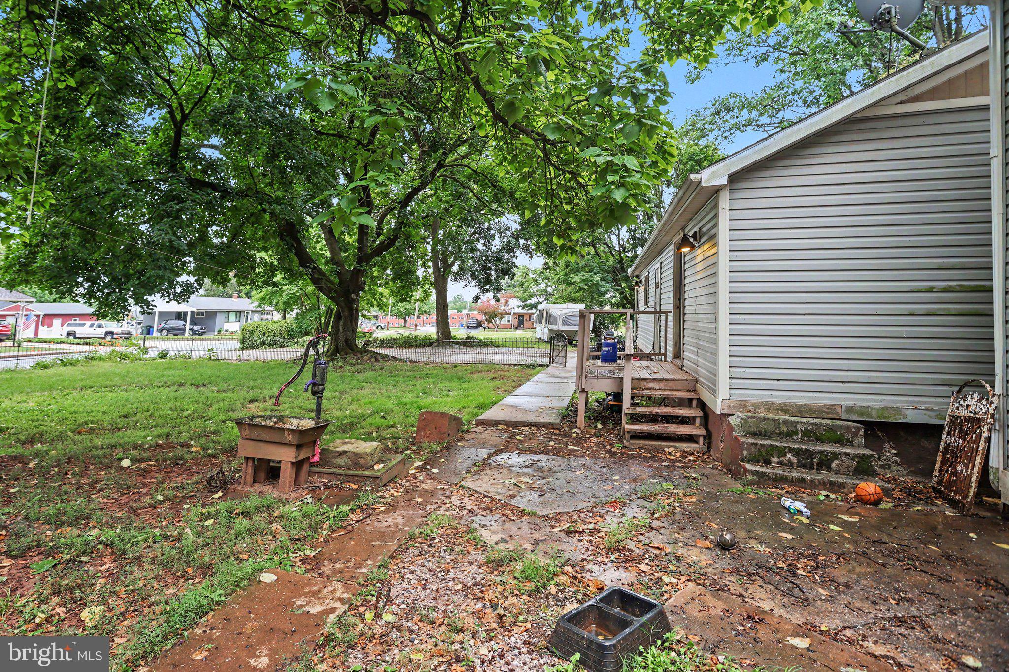 61 Mayfield Street Dover, PA 17315 - Photo 7 of 26 Charming yard with lush greenery.