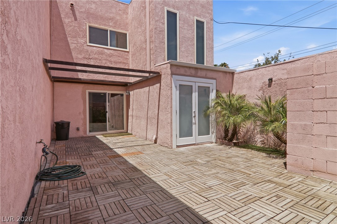 2274 East Desert Inn Road Las Vegas, NV 89169 - Photo 38 of 41 A private courtyard features wooden deck tiles and direct access to the home's interior.