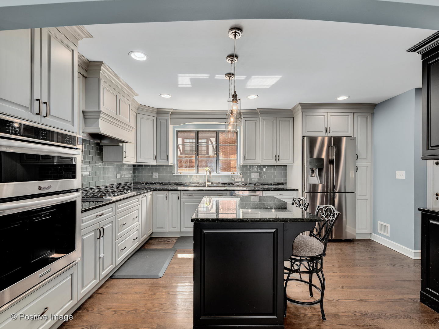331 Selborne Road Riverside, IL 60546 - Photo 11 of 19 a kitchen with stainless steel appliances granite countertop a stove and a refrigerator