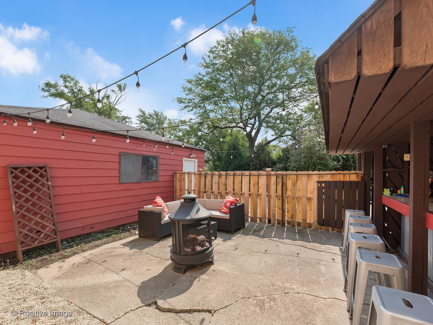 331 Selborne Road Riverside, IL 60546 - Photo 16 of 19 a view of a patio with a table and chairs and potted plants
