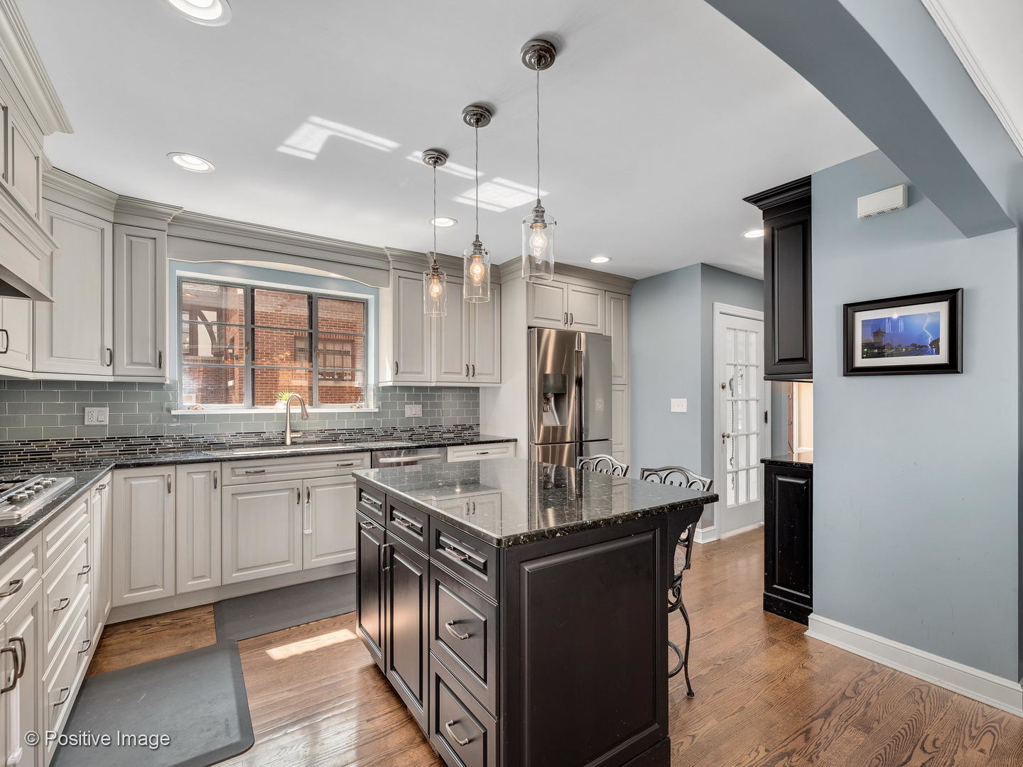 331 Selborne Road Riverside, IL 60546 - Photo 9 of 19 a kitchen with stainless steel appliances granite countertop a sink stove and refrigerator