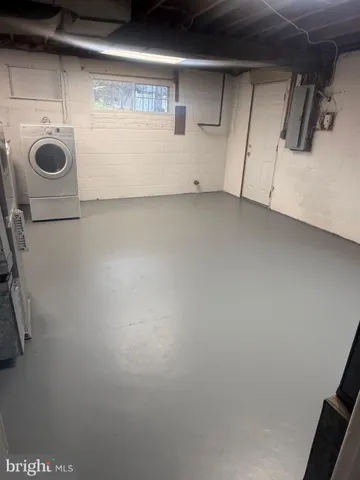 a view of storage and utility room with washer and dryer