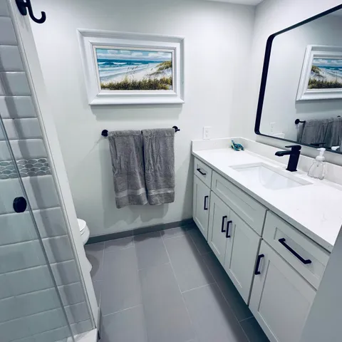 a bathroom with a double vanity sink and a mirror