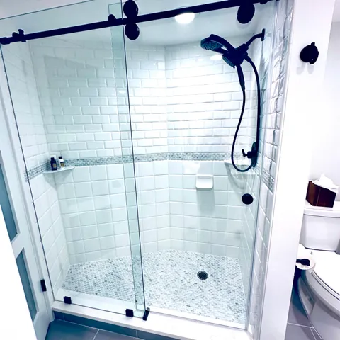 a bathroom with a shower and a mirror