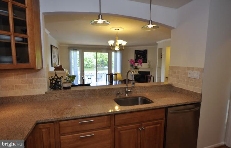 2013 Chadds Ford Drive Reston, VA 20191 - Photo 13 of 24 The kitchen opens to the dining room w/lake views.