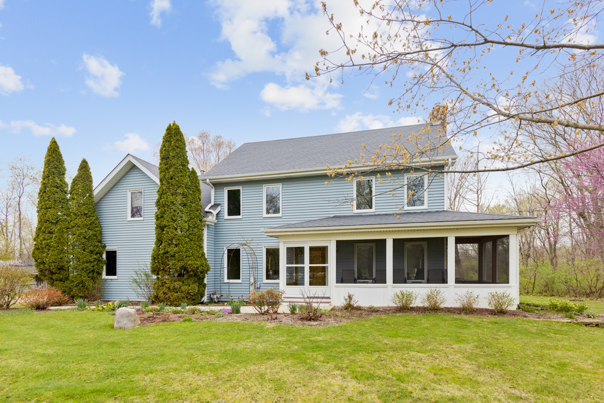 43W330 Main Street Road Elburn, IL 60119 - Photo 1 of 34 a front view of house with yard and green space