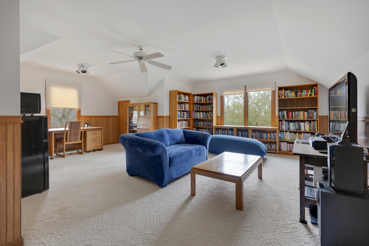 43W330 Main Street Road Elburn, IL 60119 - Photo 21 of 34 a living room with furniture and a flat screen tv