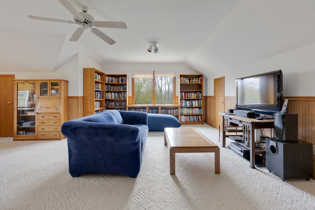 43W330 Main Street Road Elburn, IL 60119 - Photo 22 of 34 a living room with furniture and a flat screen tv