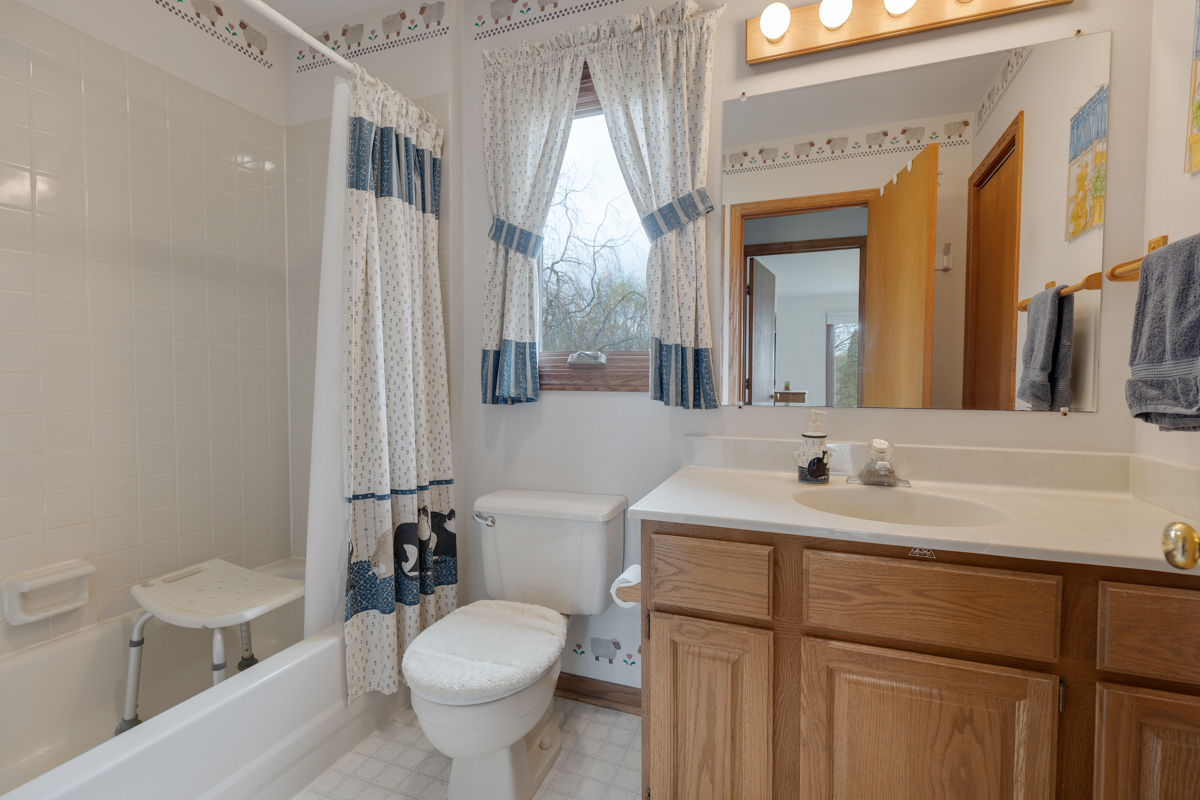 43W330 Main Street Road Elburn, IL 60119 - Photo 25 of 34 a bathroom with a toilet sink and mirror