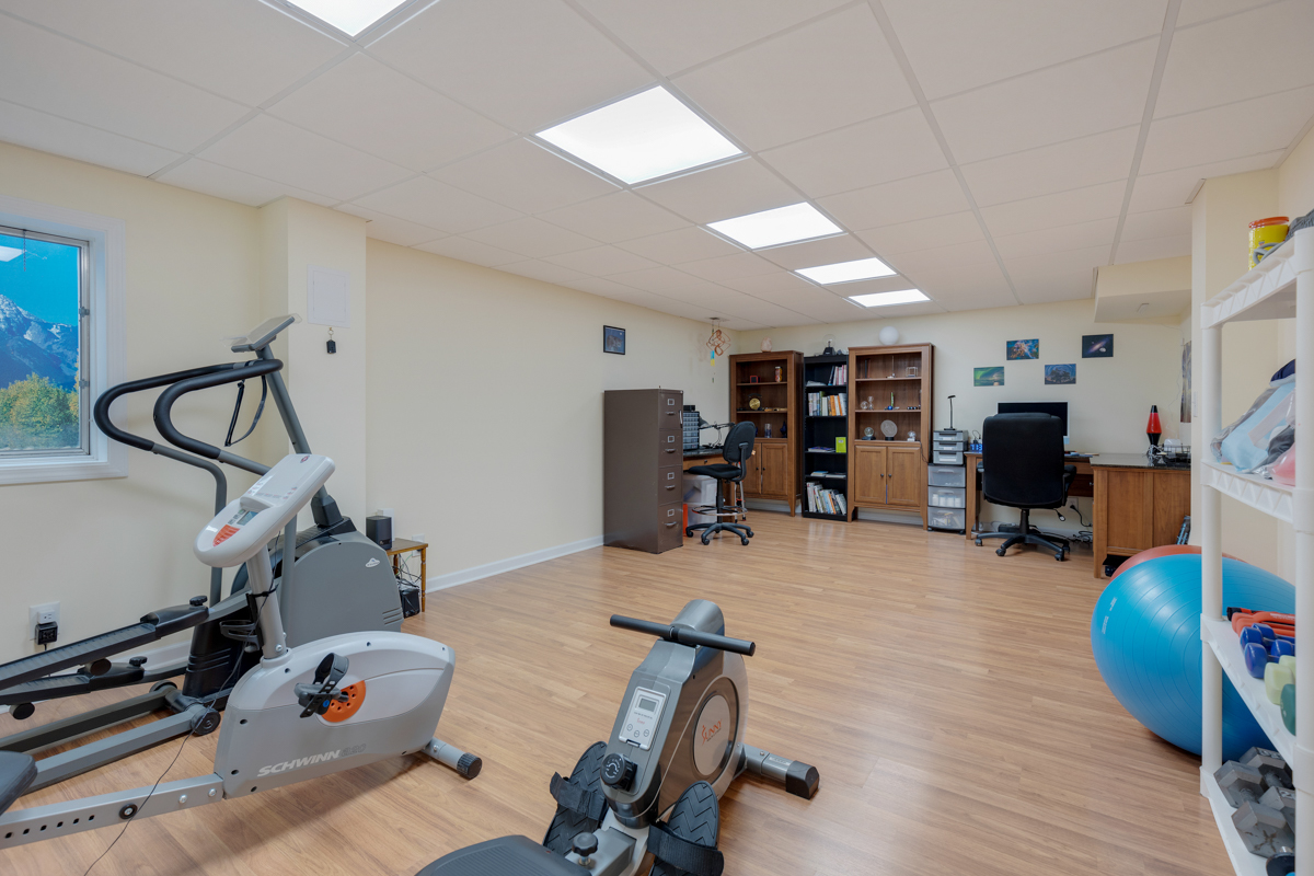43W330 Main Street Road Elburn, IL 60119 - Photo 29 of 34 a room with gym equipment and a wooden floor