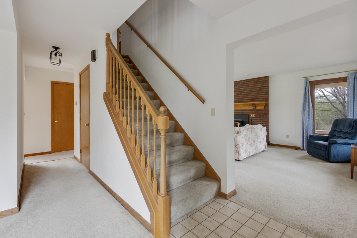 43W330 Main Street Road Elburn, IL 60119 - Photo 6 of 34 a view of staircase and living room with furniture