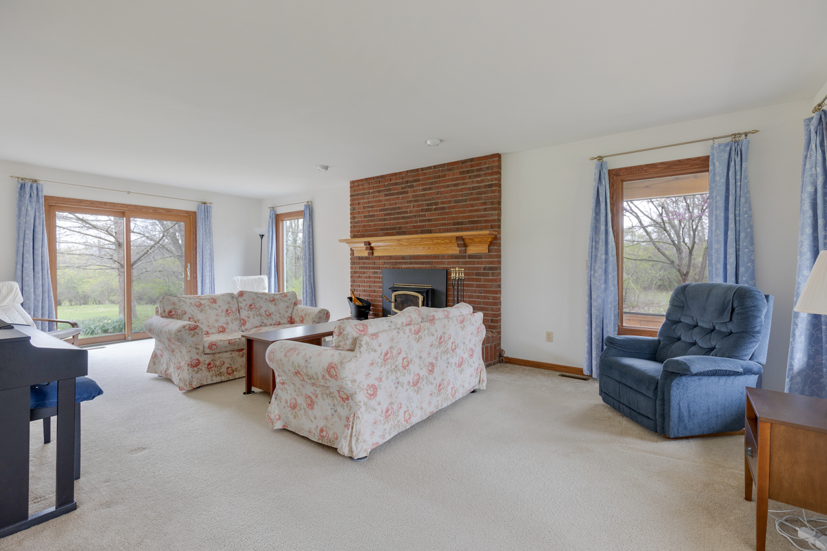 43W330 Main Street Road Elburn, IL 60119 - Photo 7 of 34 a living room with furniture and a fireplace