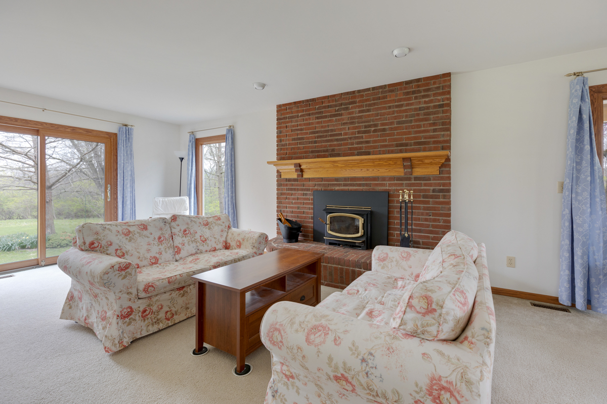 43W330 Main Street Road Elburn, IL 60119 - Photo 8 of 34 a living room with furniture and a fireplace