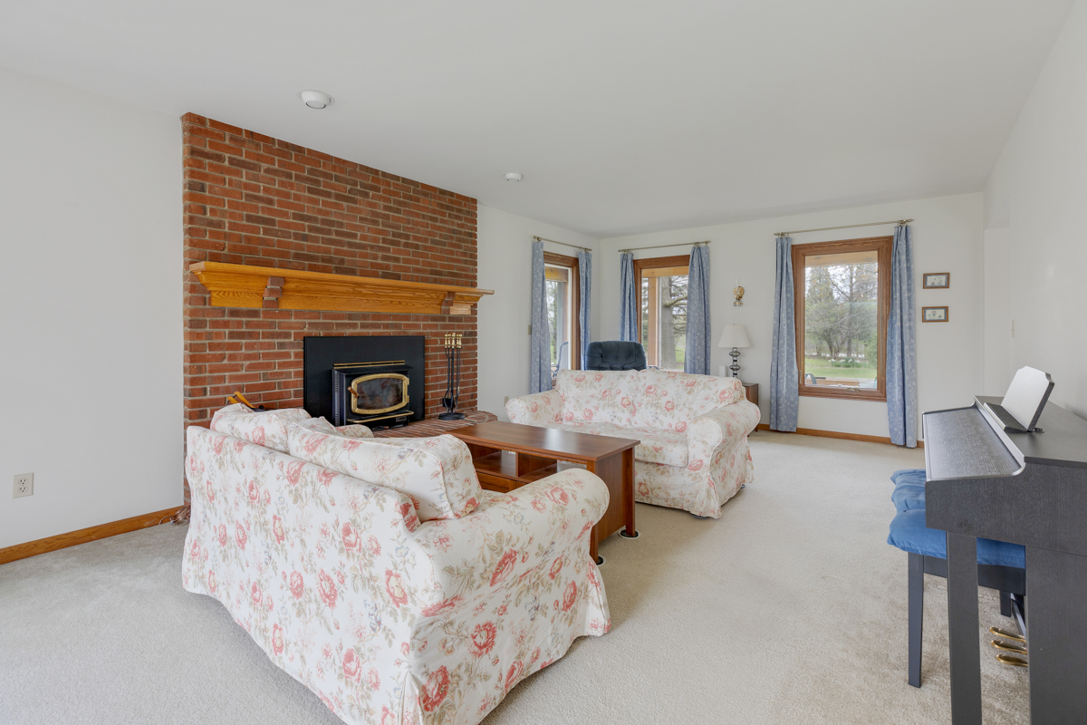 43W330 Main Street Road Elburn, IL 60119 - Photo 10 of 34 a living room with furniture and a fireplace